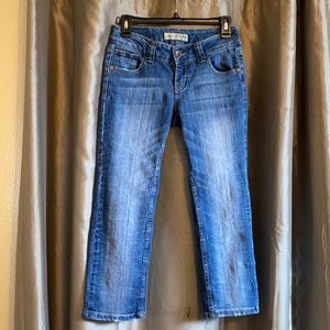A pair of crop jeans made by Paris Blues.